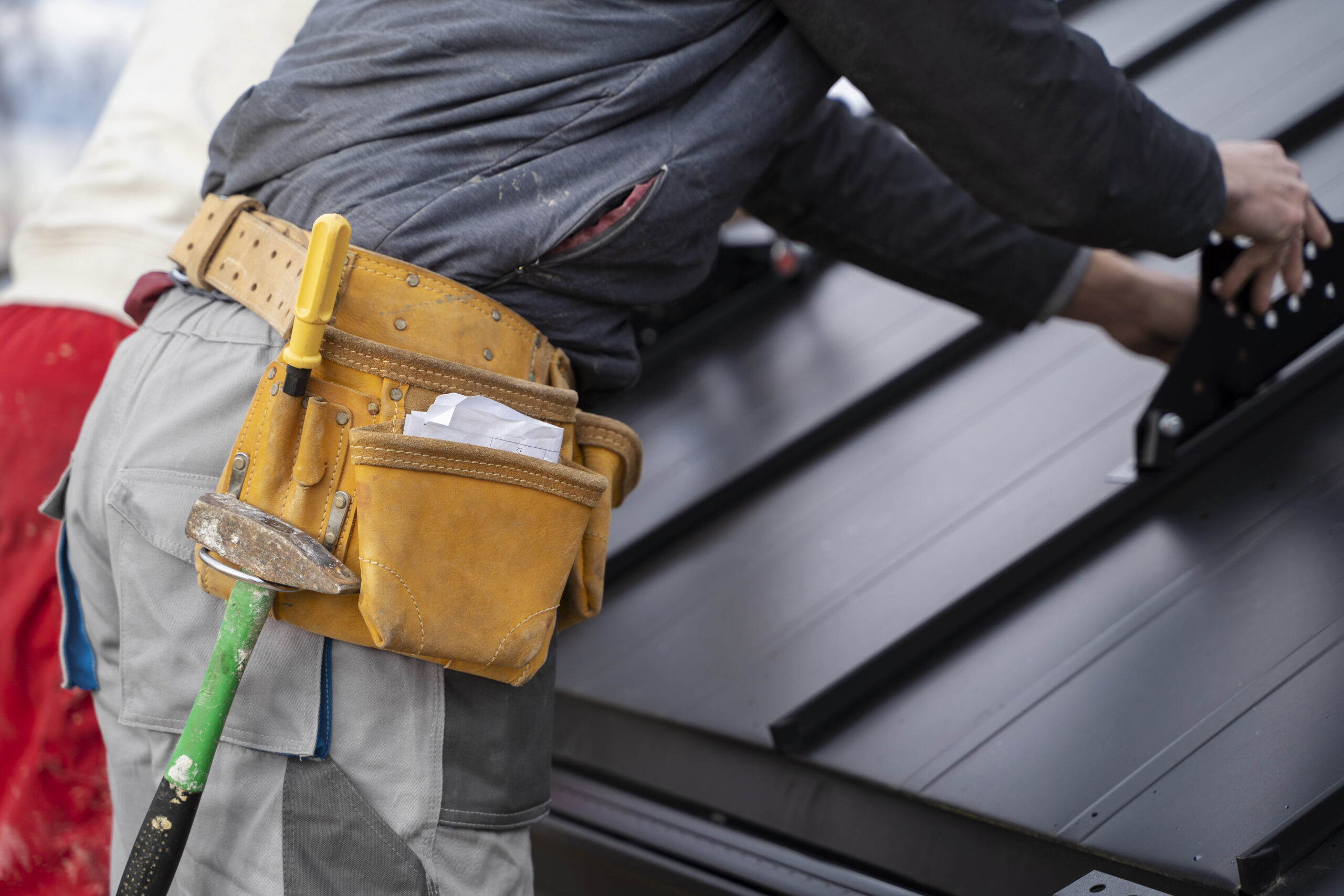 Home construction worker doing his job with belt