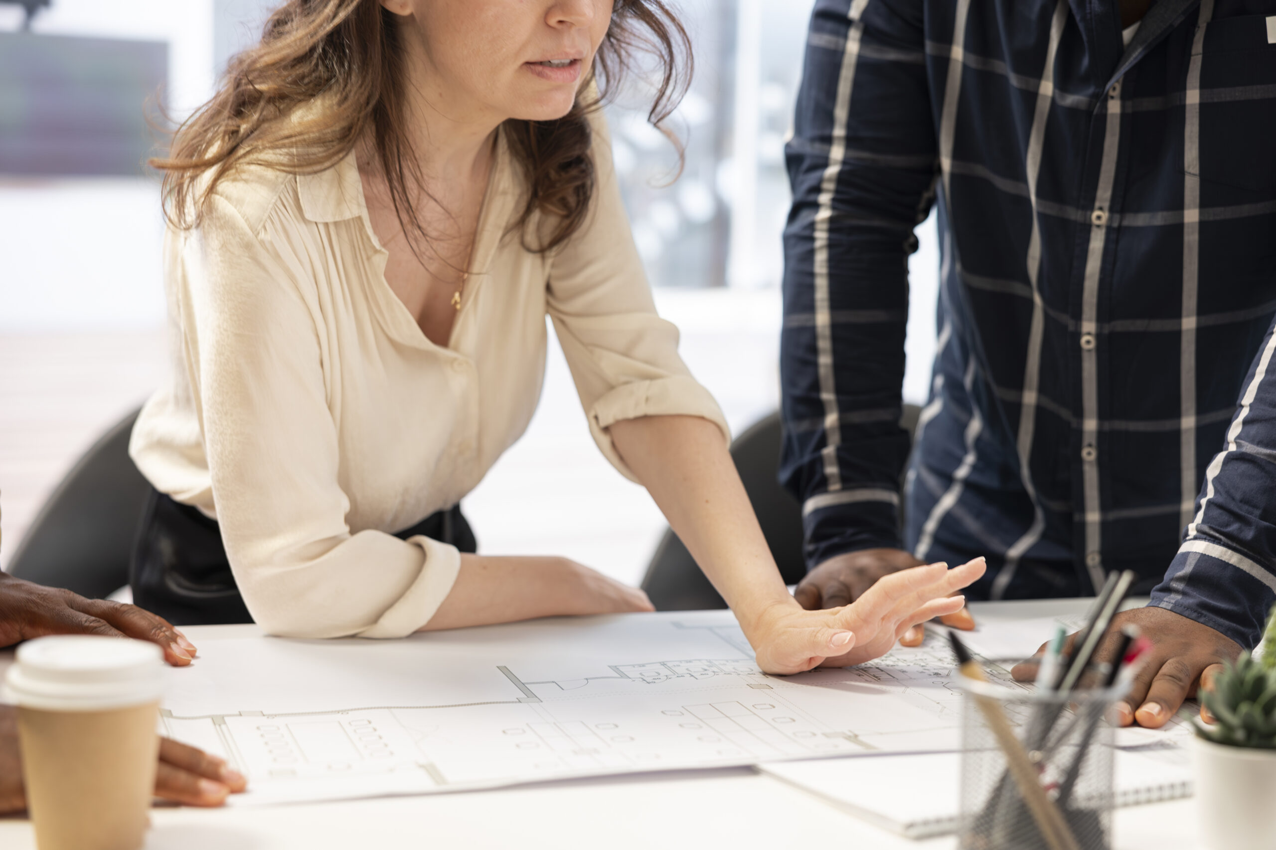 Home real estate agents studying the layout of the high class office space building